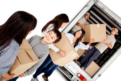 Moving team loading household items for removals near West Hampstead