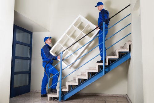 Commercial moving crew handling desks and boxes