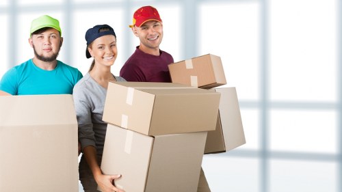 Packed moving boxes and household items prepared for relocation in West Hampstead
