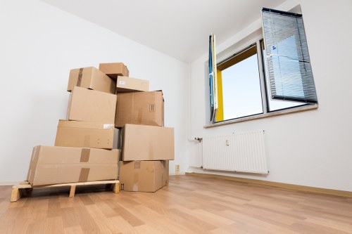 House movers loading furniture with care in a West Hampstead neighborhood