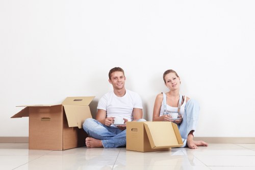 Packed moving boxes and furniture for a local home relocation