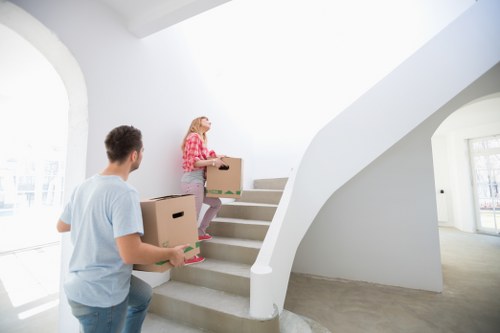 Commercial movers transporting furniture during a Westhampstead office move