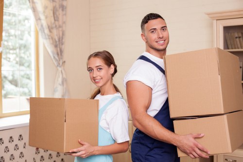 Organised moving boxes labelled for different rooms