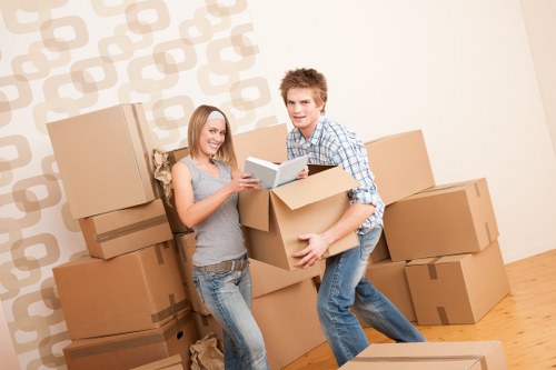 Organised moving team preparing items for safe transport