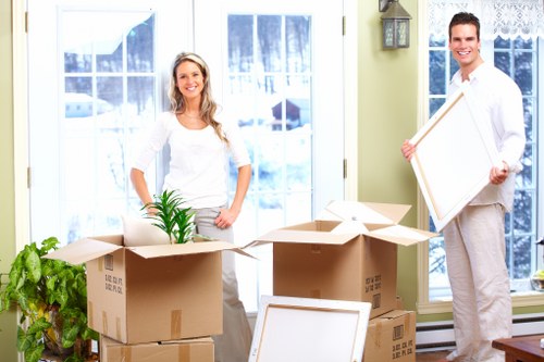 Boxes and furniture being loaded into a removals van