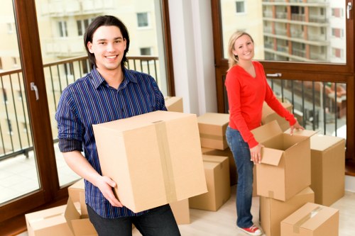 Professional movers handling furniture in a flat