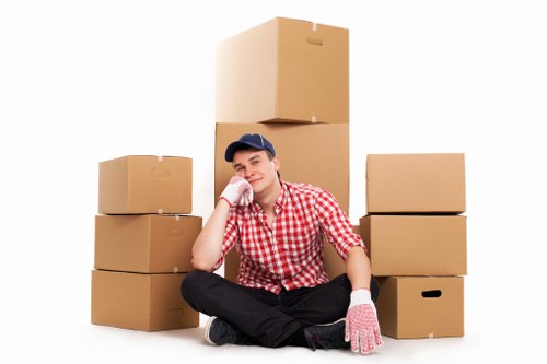 Professional movers loading items into a van in West Hampstead